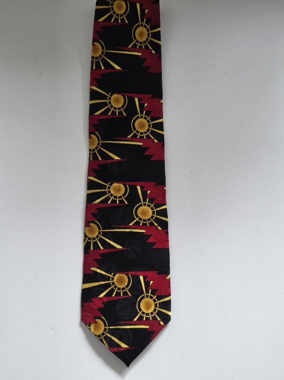 Grateful Dead Black Tie with Gold Sunburst and Red Zigzag Pattern